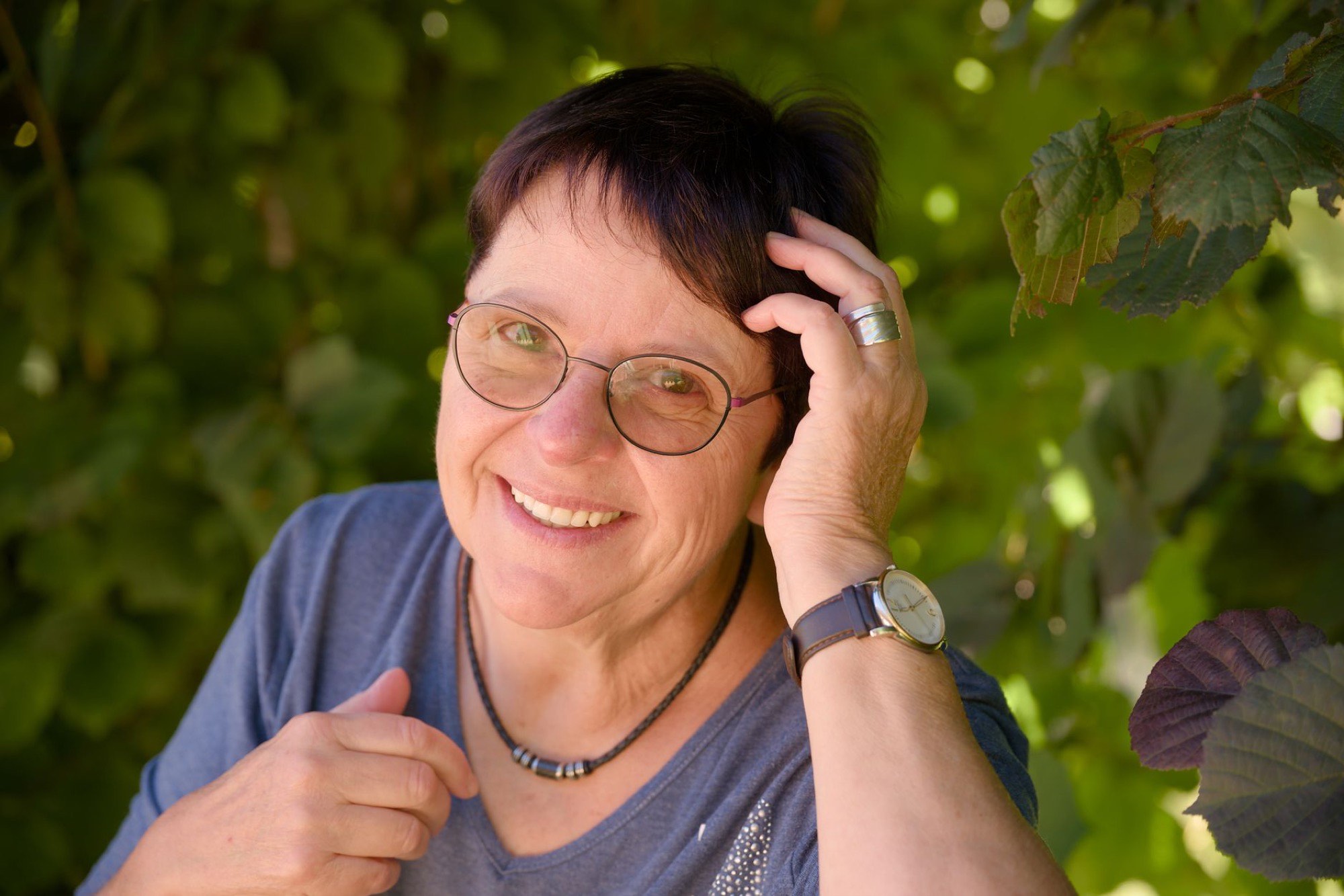 Older woman smiling outdoors